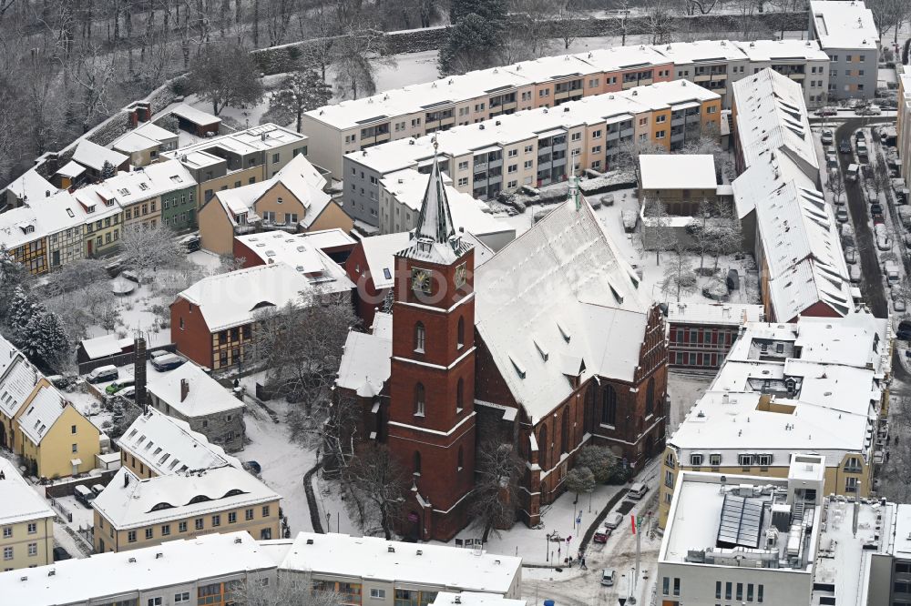 Aerial photograph Bernau - Wintry snowy church building Herz-Jesu-Kirche in Bernau in the state Brandenburg
