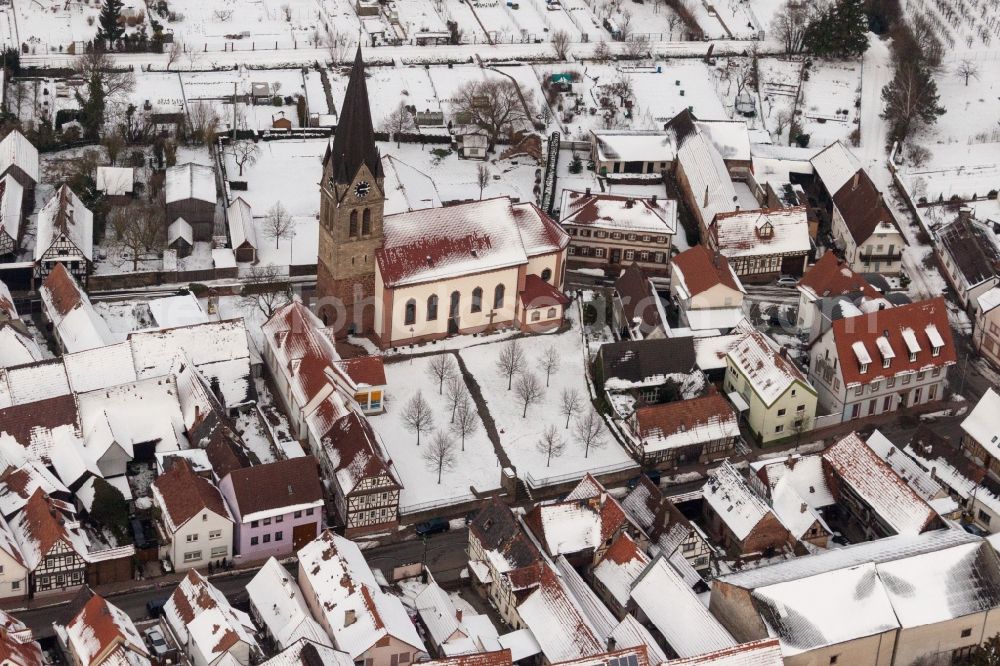 Steinweiler from the bird's eye view: Wintry snowy Catholic Church building in the village of in Steinweiler in the state Rhineland-Palatinate, Germany