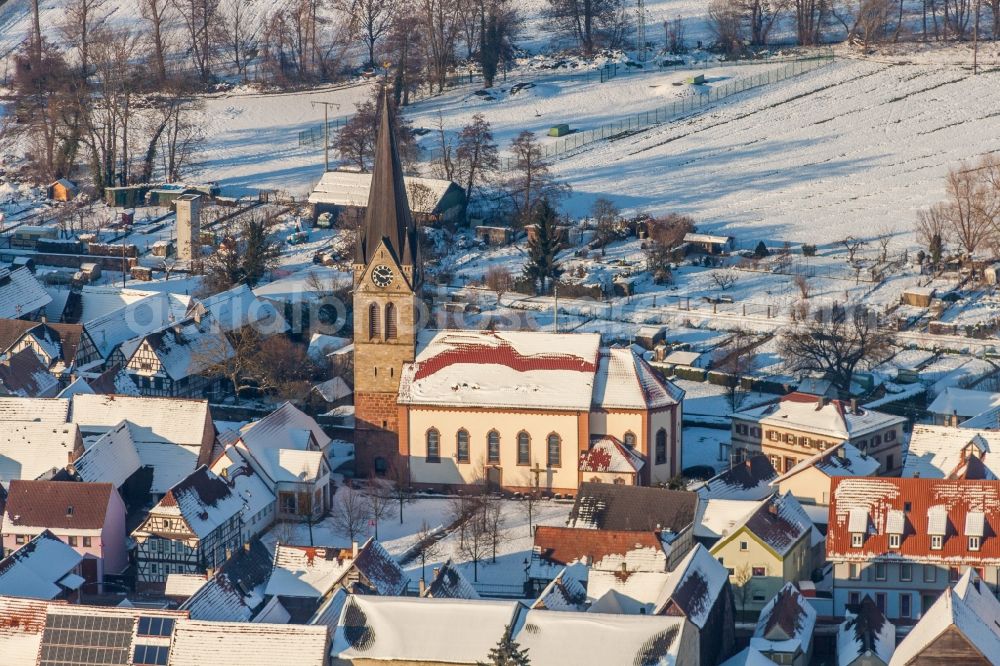 Steinweiler from the bird's eye view: Wintry snowy Catholic Church building in the village of in Steinweiler in the state Rhineland-Palatinate, Germany