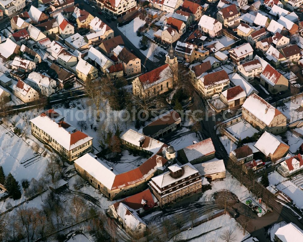 Bonfeld from the bird's eye view: Wintry snowy church building Margarethen Kirche in the village of in Bonfeld in the state Baden-Wuerttemberg, Germany