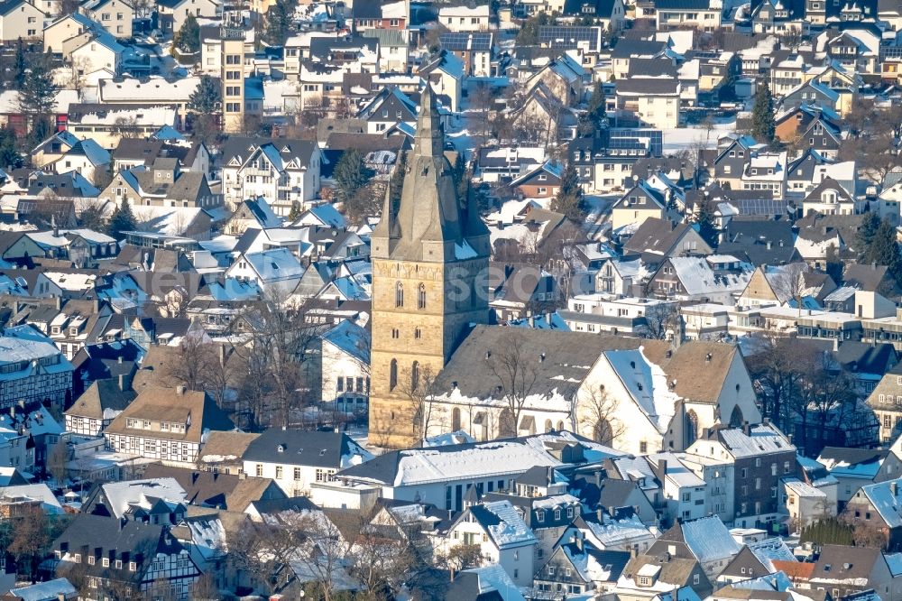 Aerial image Brilon - Wintry snowy church building in Petrusstrasse - Schulstrasse Old Town- center of downtown in Brilon in the state North Rhine-Westphalia