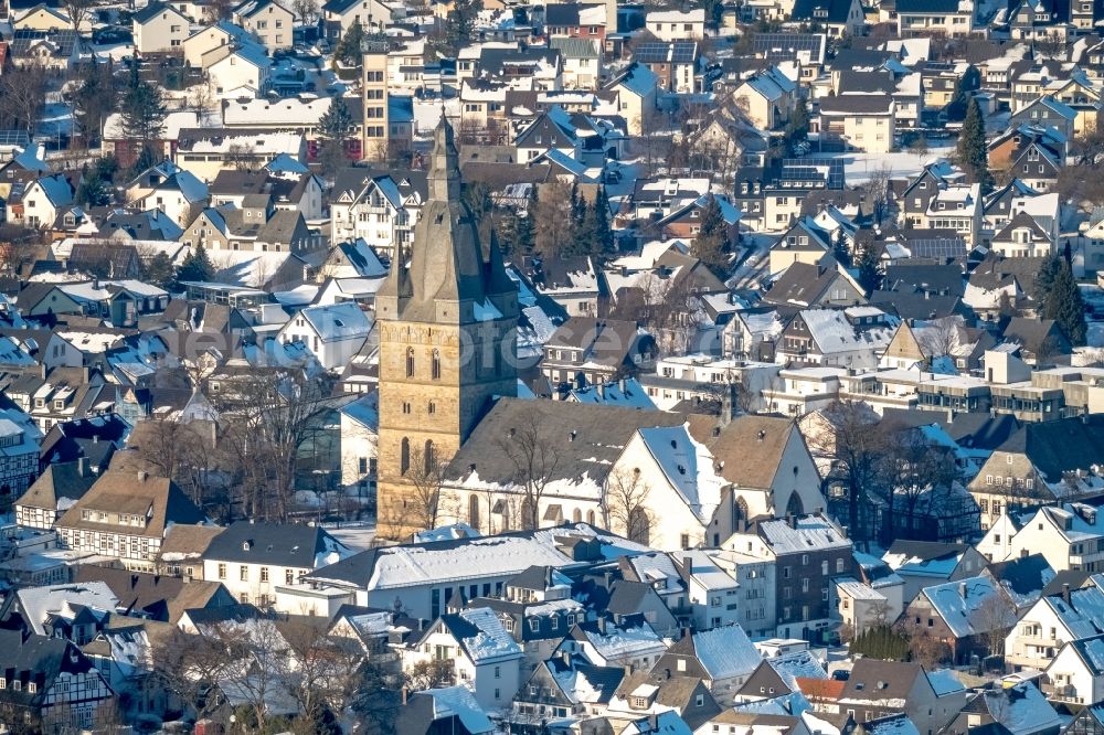 Brilon from above - Wintry snowy church building in Petrusstrasse - Schulstrasse Old Town- center of downtown in Brilon in the state North Rhine-Westphalia