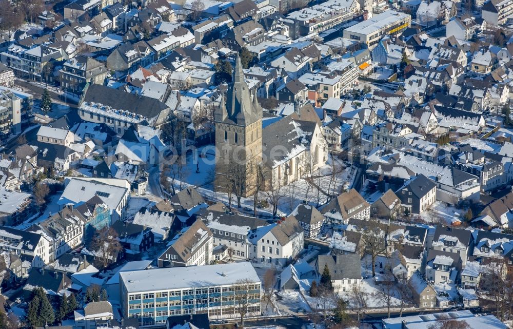 Aerial photograph Brilon - Wintry snowy church buildings of the Propstei church Saint Peter and Andreas in Brilon in the federal state North Rhine-Westphalia