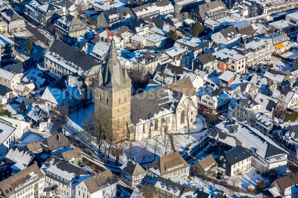 Brilon from above - Wintry snowy church buildings of the Propstei church Saint Peter and Andreas in Brilon in the federal state North Rhine-Westphalia