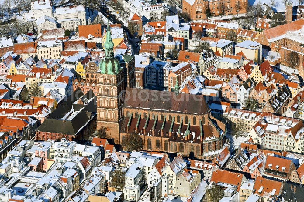 Stralsund from above - Wintry snowy church building Sankt Nikolai -Gemeinde in the district Andershof in Stralsund in the state Mecklenburg - Western Pomerania