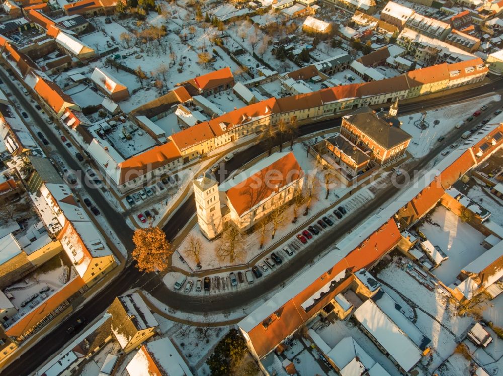 Liebenwalde from above - Wintry snowy church building in Stadtkirche on Marktplatz Old Town- center of downtown in Liebenwalde in the state Brandenburg, Germany