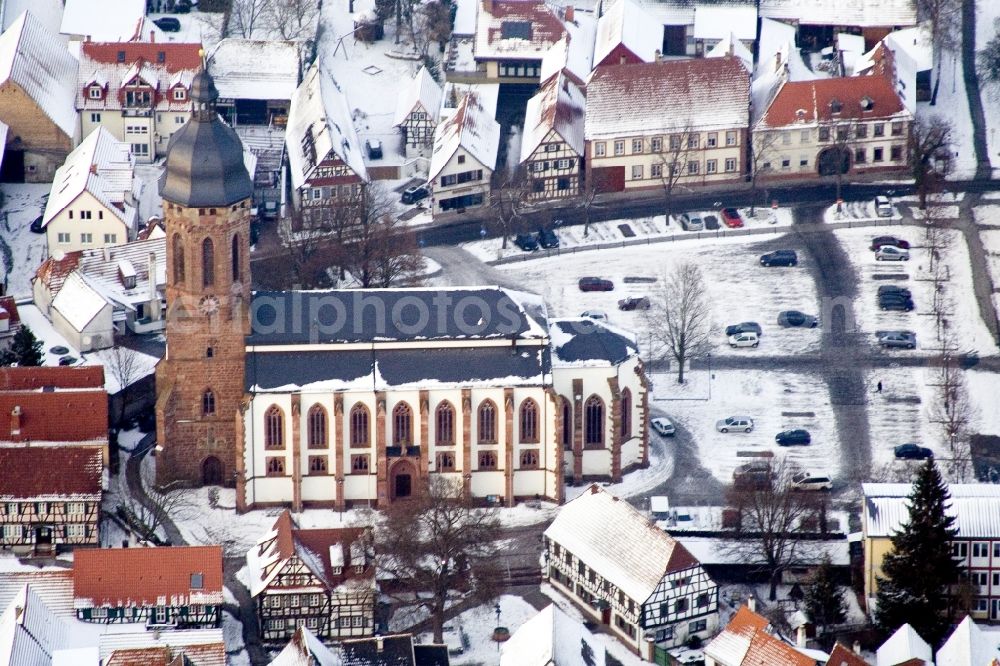 Kandel from the bird's eye view: Wintry snowy Church building in of St.Georgs church at the market in Old Town- center of downtown in Kandel in the state Rhineland-Palatinate