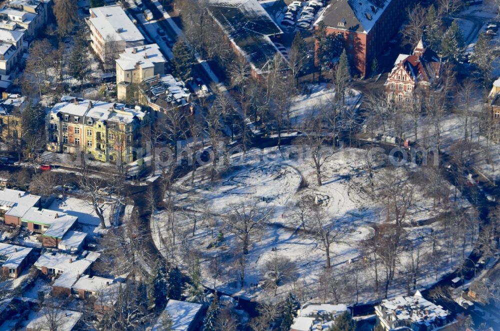 Aerial image Berlin - Wintry snowy circular surface - Place Augustaplatz in Berlin, Germany