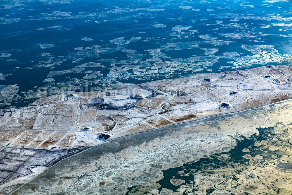 Aerial image Langeneß - Wintry snowy coastal area of the North Sea- Island in Langeness in the state Schleswig-Holstein