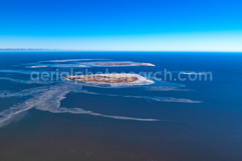 Insel Neuwerk from the bird's eye view: Wintry snowy coastal area of North Sea - Island in Insel Neuwerk in the state Lower Saxony, Germany