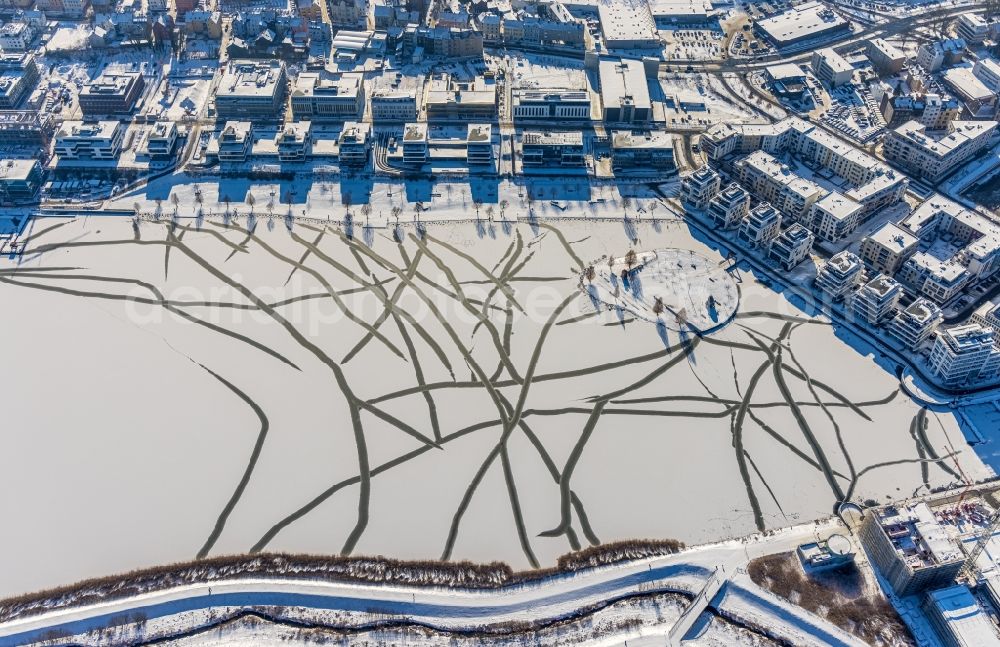 Dortmund from above - Wintry snowy lake Island on the Plateau on Phoenix See in the district Hoerde in Dortmund in the state North Rhine-Westphalia, Germany