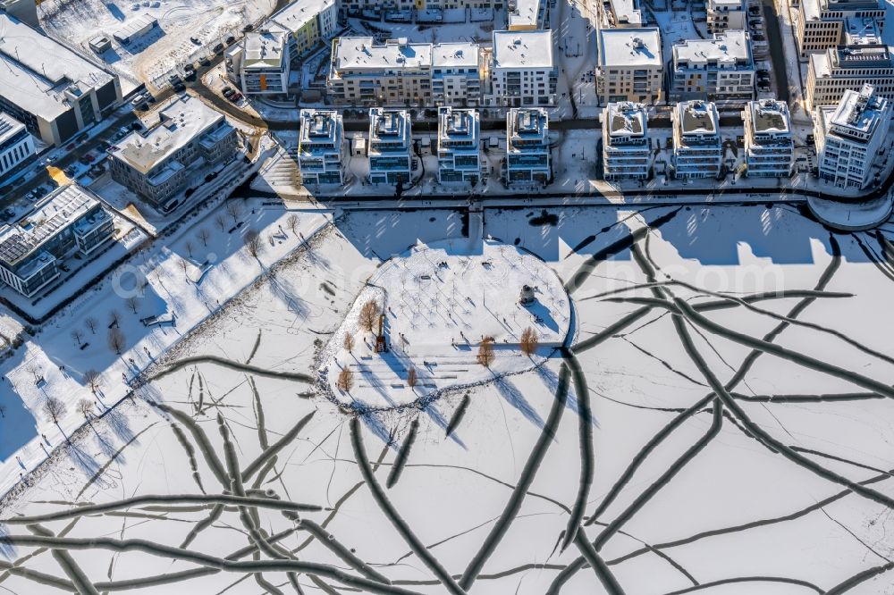 Dortmund from the bird's eye view: Wintry snowy lake Island on the Plateau on Phoenix See in the district Hoerde in Dortmund at Ruhrgebiet in the state North Rhine-Westphalia, Germany