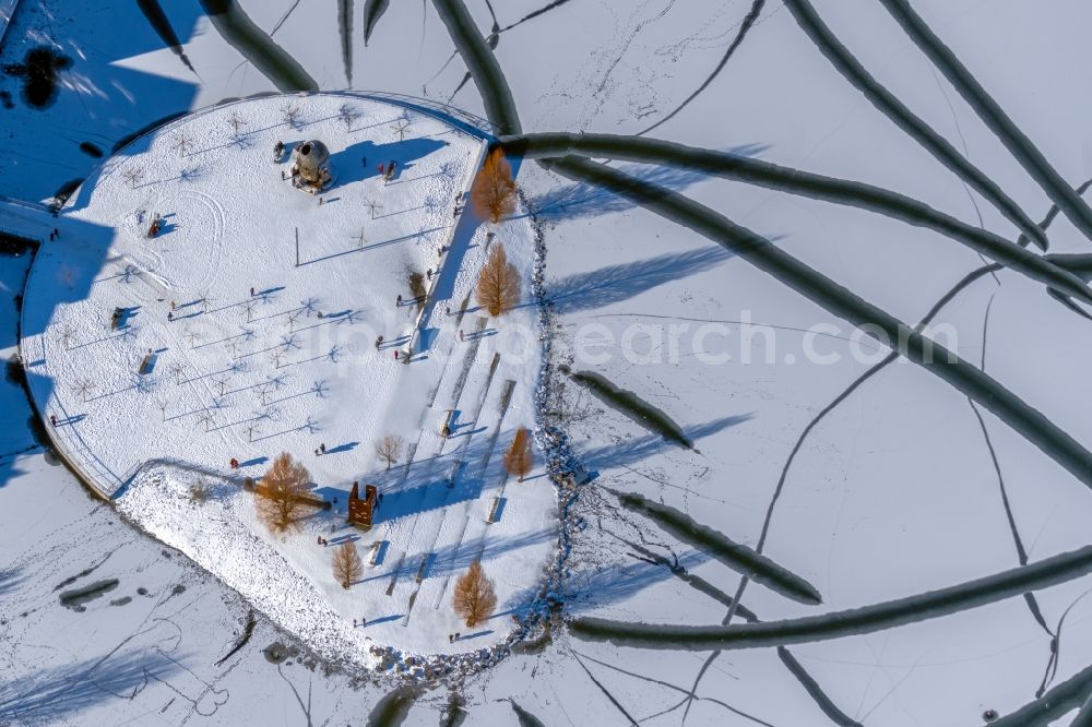 Dortmund from above - Wintry snowy lake Island on the Plateau on Phoenix See in the district Hoerde in Dortmund at Ruhrgebiet in the state North Rhine-Westphalia, Germany