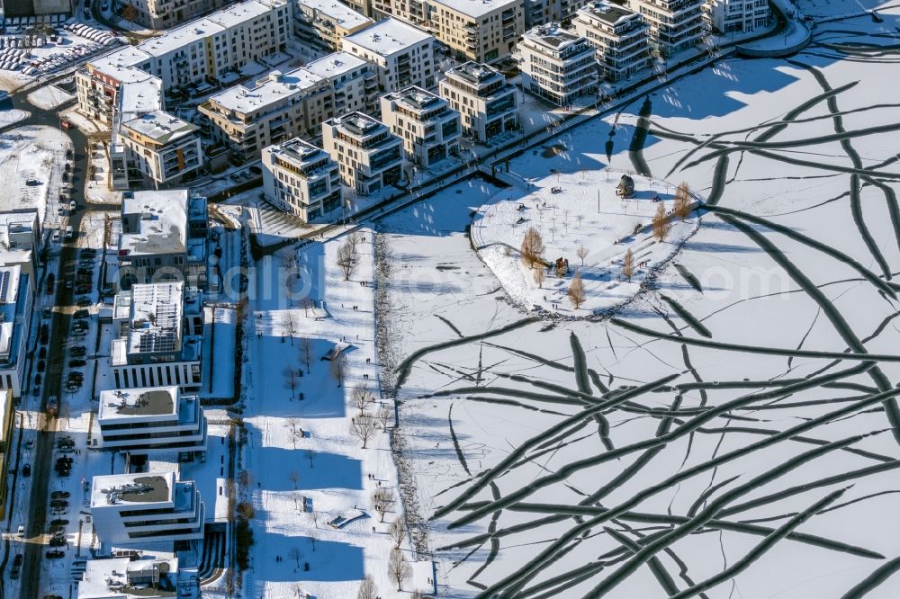 Dortmund from the bird's eye view: Wintry snowy lake Island on the Plateau on Phoenix See in the district Hoerde in Dortmund at Ruhrgebiet in the state North Rhine-Westphalia, Germany