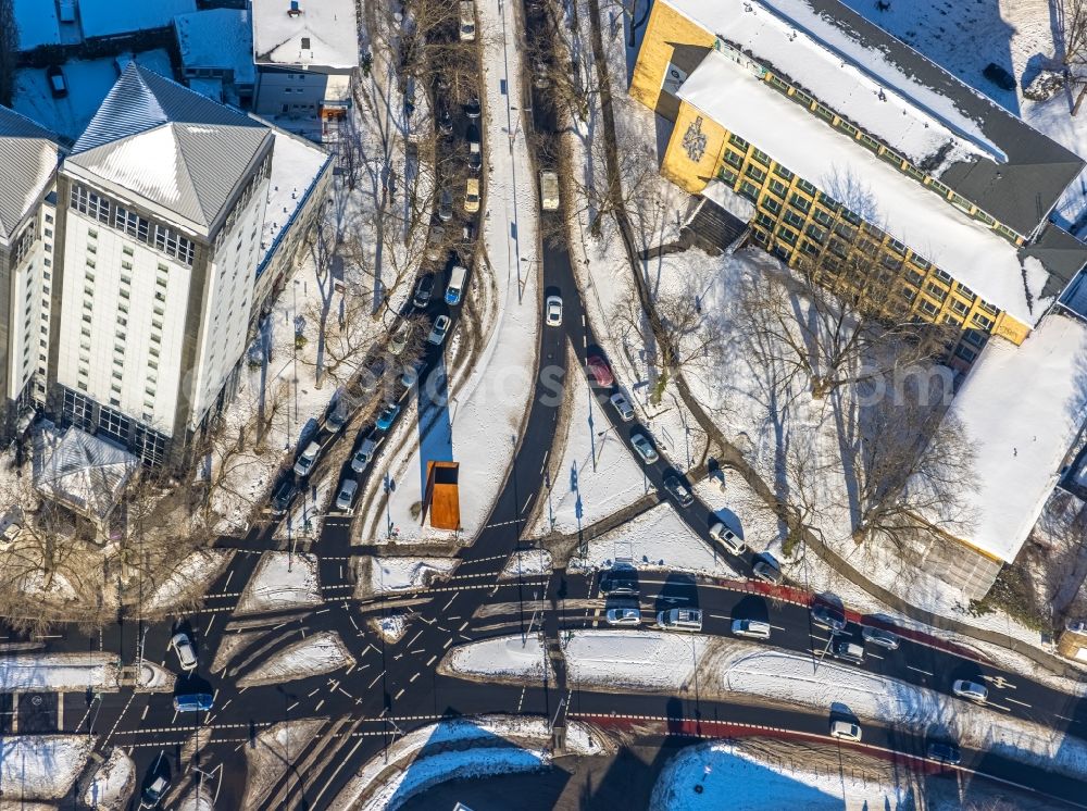 Bochum from the bird's eye view: Wintry snowy road over the crossroads Massenbergstrasse - Kurt-Schumacher-Platz in the district Innenstadt in Bochum in the state North Rhine-Westphalia, Germany