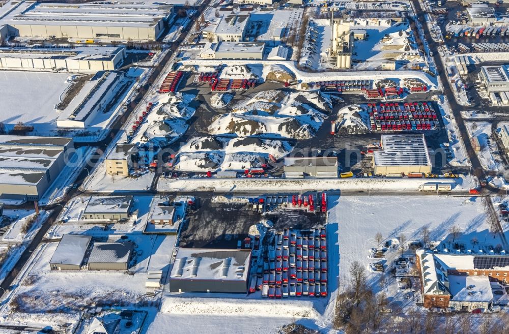 Aerial photograph Werl - Wintry snowy warehouses and forwarding building for building materials of the Mimberg Spedition & Baustoffe GmbH & Co. KG on Havervoehde in Werl at Ruhrgebiet in the state North Rhine-Westphalia, Germany