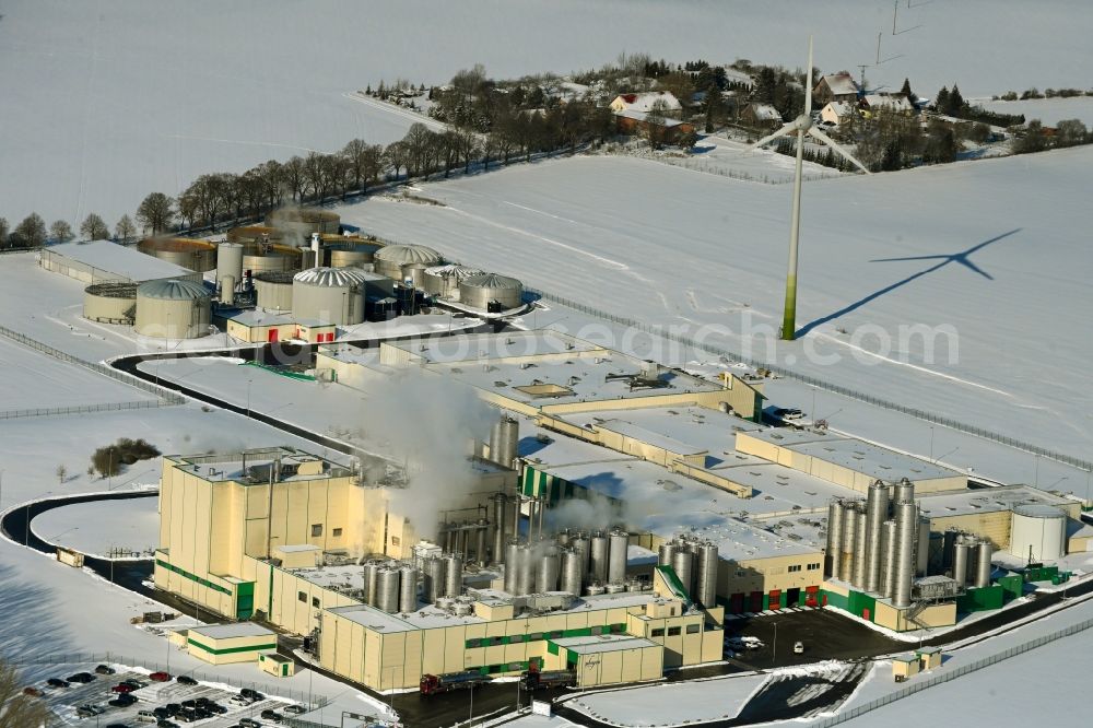 Aerial image Klatzow - Wintry snowy buildings and production halls on the food manufacturer's premises DMK Deutsches Milchkontor GmbH in Klatzow in the state Mecklenburg - Western Pomerania, Germany