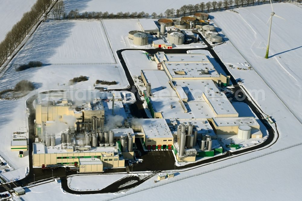 Aerial image Klatzow - Wintry snowy buildings and production halls on the food manufacturer's premises DMK Deutsches Milchkontor GmbH in Klatzow in the state Mecklenburg - Western Pomerania, Germany