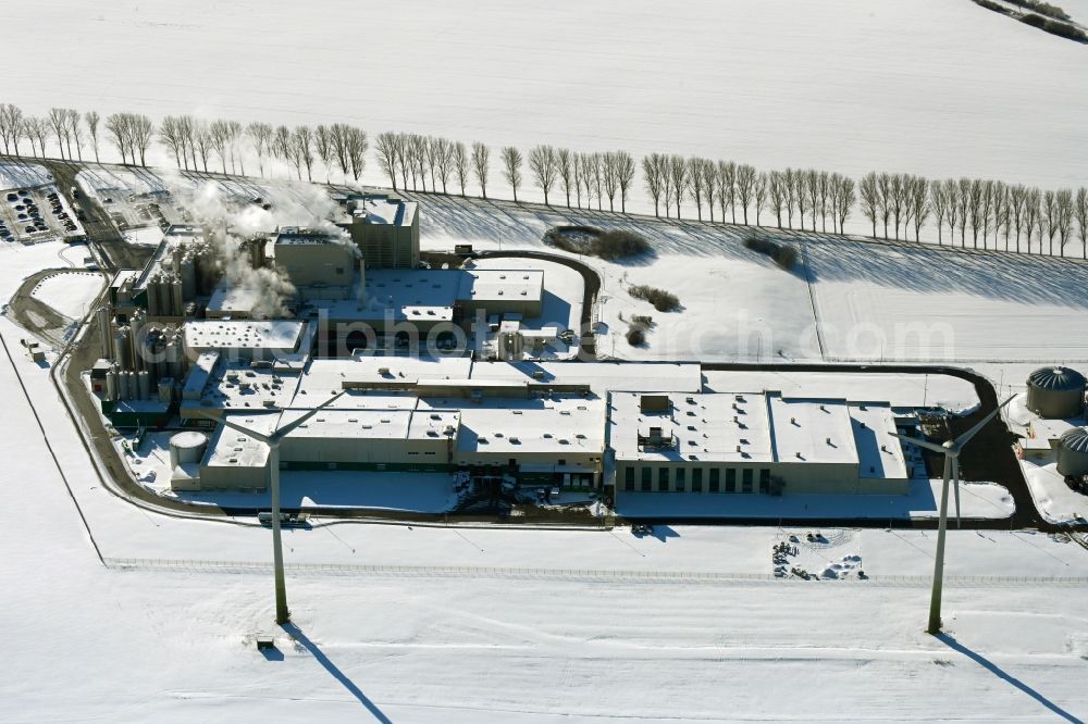 Aerial image Klatzow - Wintry snowy buildings and production halls on the food manufacturer's premises DMK Deutsches Milchkontor GmbH in Klatzow in the state Mecklenburg - Western Pomerania, Germany