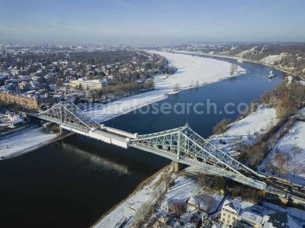 Dresden from above - Wintry snowy loschwitz Bridge Blue Wonder over the river Elbe in Dresden in the federal state of Saxony in winter. The Elbe Bridge, completed in 1893, connects the districts of Blasewitz and Loschwitz and is considered a landmark of the city