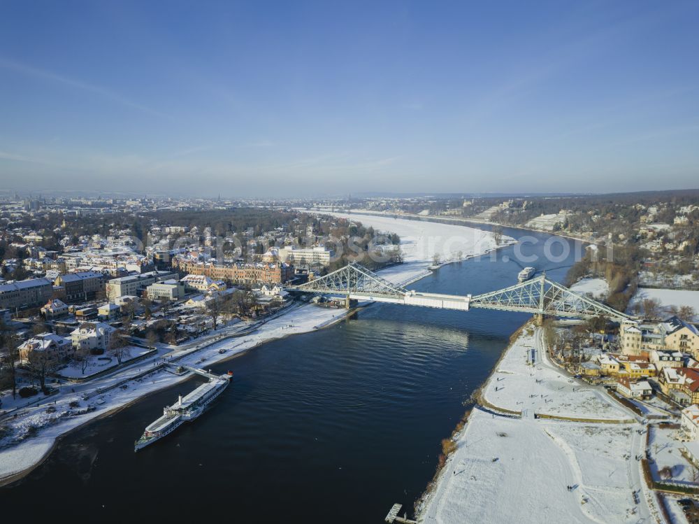 Dresden from above - Wintry snowy loschwitz Bridge Blue Wonder over the river Elbe in Dresden in the federal state of Saxony in winter. The Elbe Bridge, completed in 1893, connects the districts of Blasewitz and Loschwitz and is considered a landmark of the city