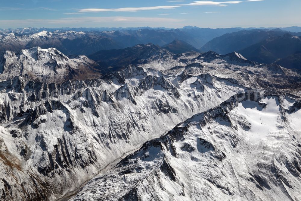 Blenio from the bird's eye view: Wintry snowy Glaciers Maighelsgletscher in the rock and mountain landscape of the Swiss Alps at Piz Ravetsch in Blenio in the canton Ticino, Switzerland