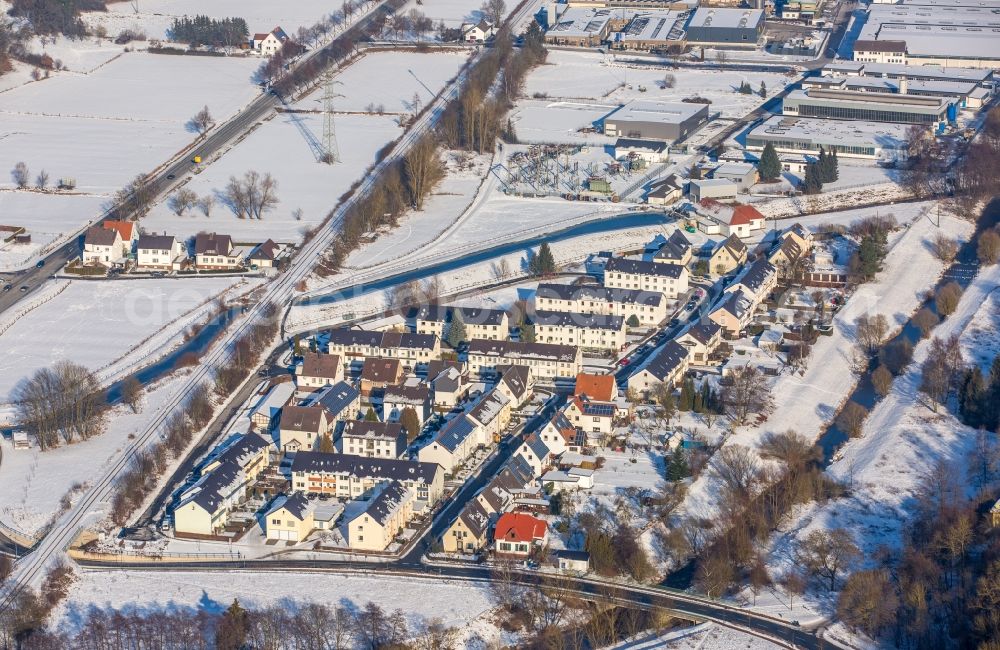 Aerial image Marsberg - Wintry snowy Mixing of residential and commercial settlements am Christopherusweg in Marsberg in the state North Rhine-Westphalia