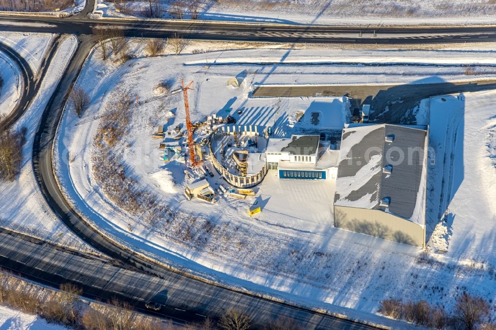 Soest from above - Wintry snowy new building construction site in the industrial park of Industriegebiet Wasserfuhr along the Opmuender Weg and the B475 in Soest in the state North Rhine-Westphalia, Germany