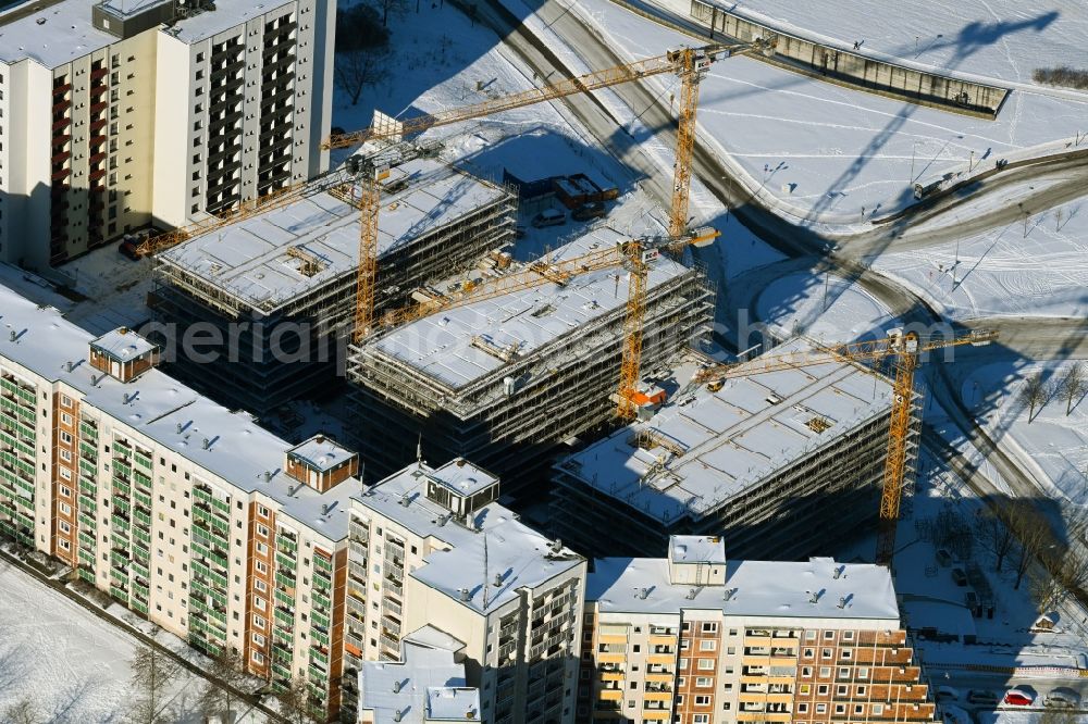 Aerial image Rostock - Wintry snowy construction site to build a new office and commercial building on Bahnhofsvorplatz in the district Suedstadt in Rostock in the state Mecklenburg - Western Pomerania, Germany