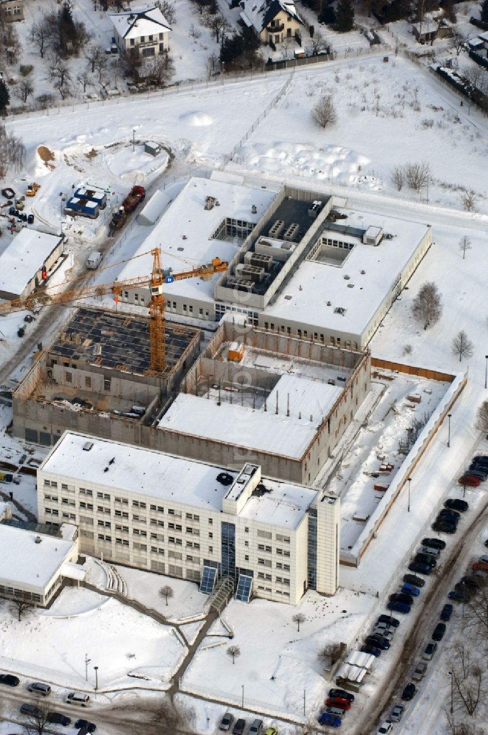 Berlin from the bird's eye view: Wintry snowy building complex and grounds of the logistics center - data center of DB Systel GmbH on Florastrasse in the district Mahlsdorf in Berlin, Germany