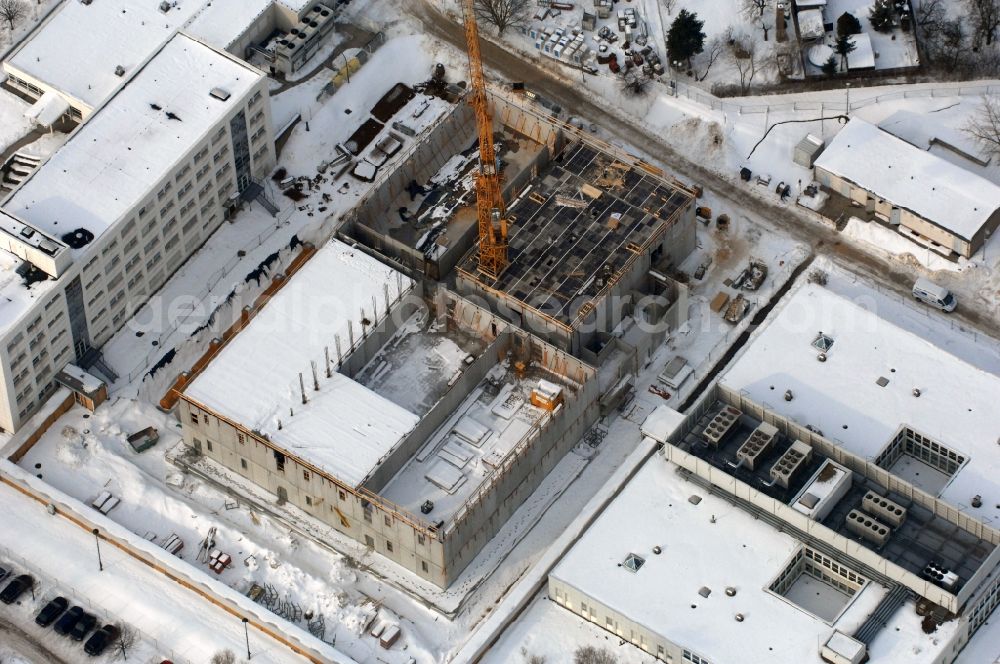 Aerial photograph Berlin - Wintry snowy building complex and grounds of the logistics center - data center of DB Systel GmbH on Florastrasse in the district Mahlsdorf in Berlin, Germany