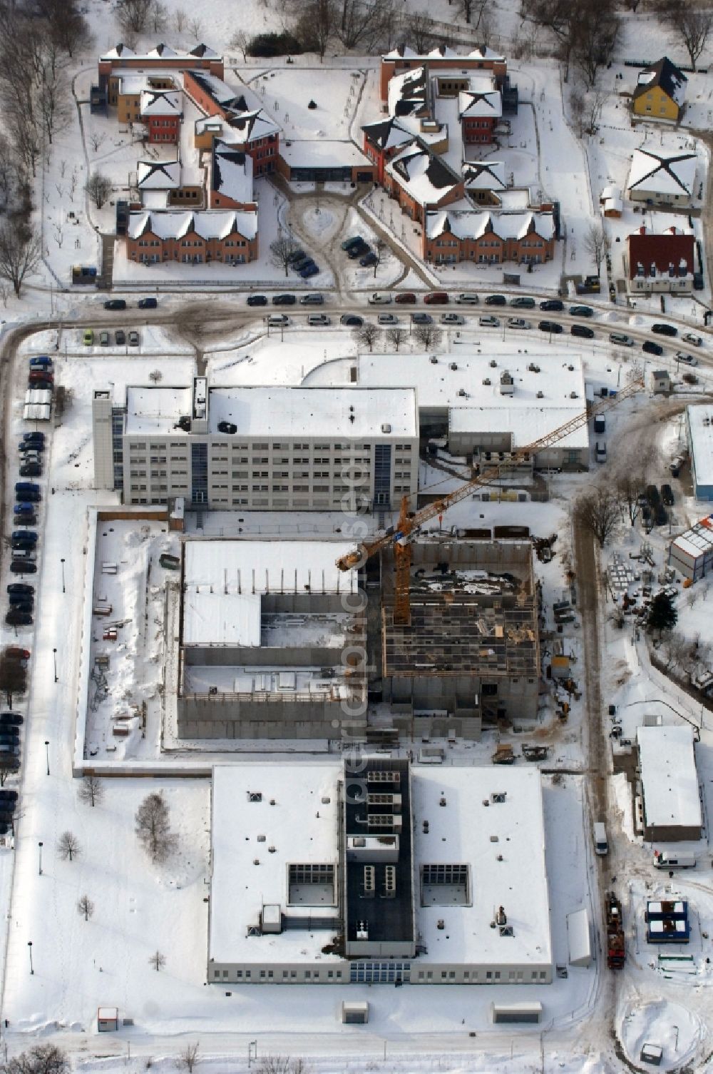 Berlin from above - Wintry snowy building complex and grounds of the logistics center - data center of DB Systel GmbH on Florastrasse in the district Mahlsdorf in Berlin, Germany