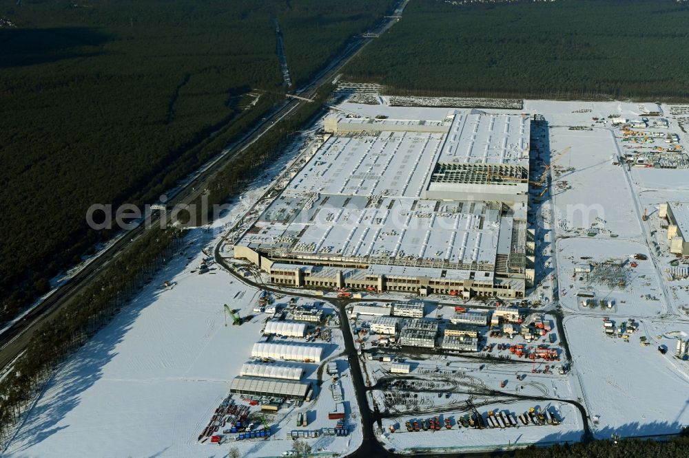 Grünheide (Mark) from above - Wintry snowy construction site for the new building of Tesla Gigafactory 4 on Schlehenweg - Eichenstrasse in the district Freienbrink in Gruenheide (Mark) in the state Brandenburg, Germany