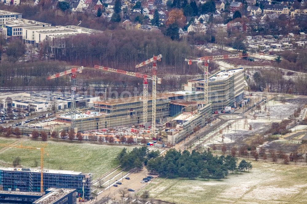 Aerial photograph Dortmund - Wintry snowy new construction of the company administration building of Materna Information & Communications SE on street Robert-Schuman-Strasse in the district Phoenix West in Dortmund at Ruhrgebiet in the state North Rhine-Westphalia, Germany