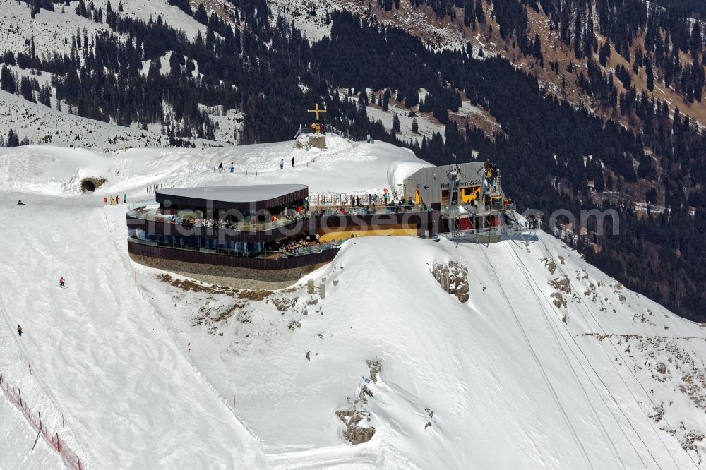 Aerial image Oberstdorf - Wintry snowy newly opened peak station of the Nebelhornbahn in Oberstdorf in the state of Bavaria. The summit restaurant was designed by architect Hermann Kaufmann. Guests can walk around the summit via the Nordwandsteig