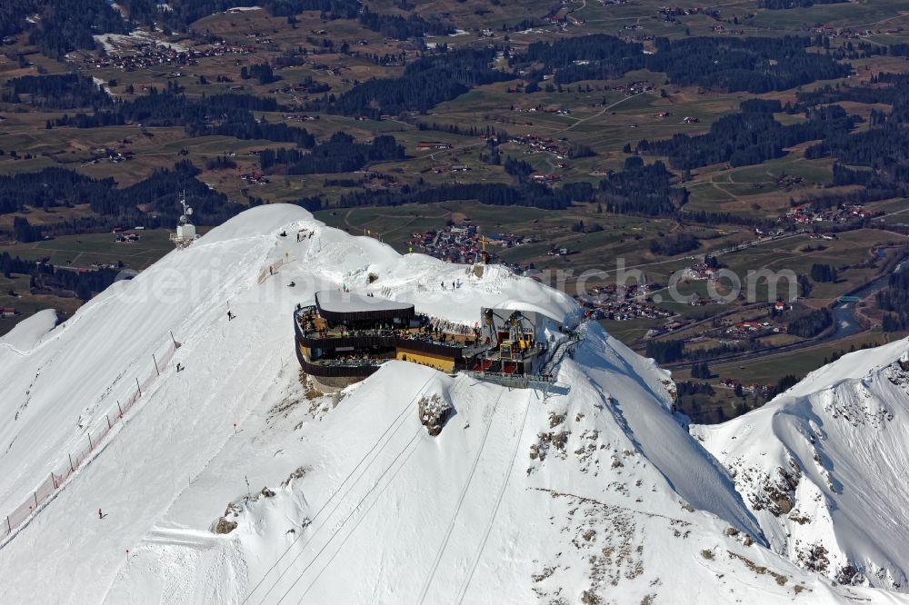 Aerial photograph Oberstdorf - Wintry snowy newly opened peak station of the Nebelhornbahn in Oberstdorf in the state of Bavaria. The summit restaurant was designed by architect Hermann Kaufmann. Guests can walk around the summit via the Nordwandsteig