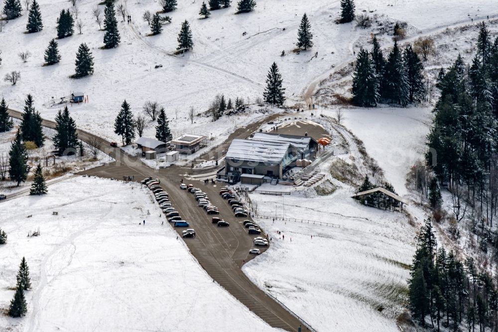 Sankt Peter from the bird's eye view: Wintry snowy new construction site the hotel complex Kandelhotel on Berg Kandel in Sankt Peter in the state Baden-Wuerttemberg, Germany