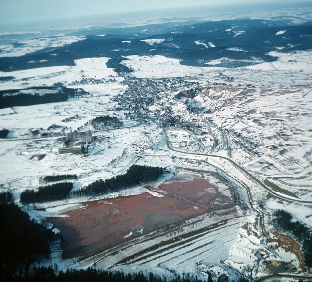 Altenberg from the bird's eye view: Wintry snowy Town View of the streets and houses of the residential areas in Altenberg in the state Saxony, Germany