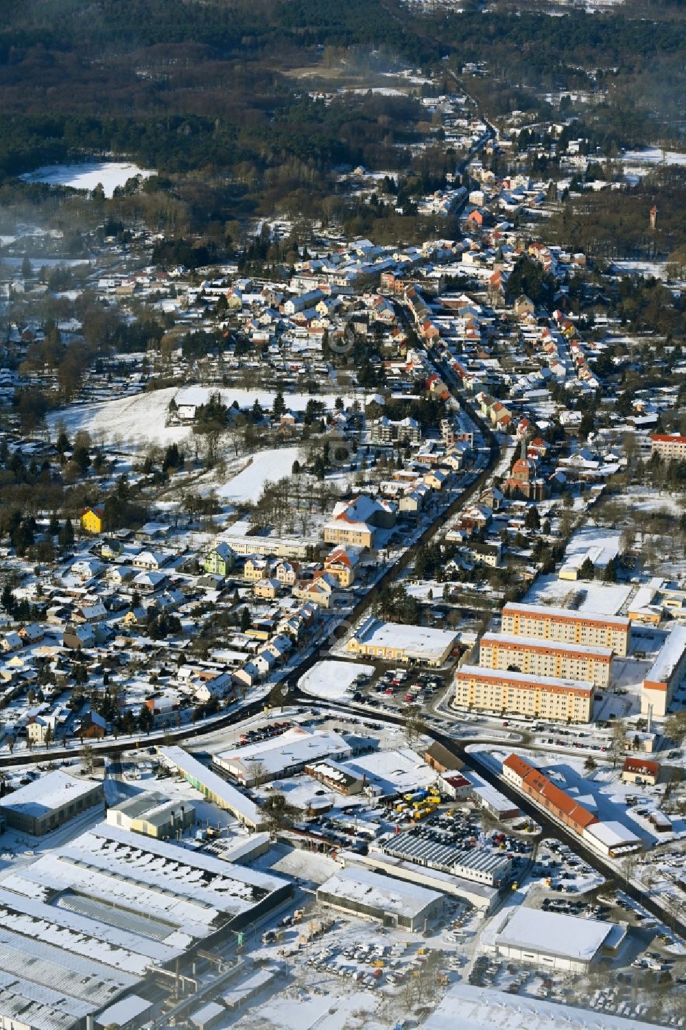 Biesenthal from above - Wintry snowy town View of the streets and houses of the residential areas in Biesenthal in the state Brandenburg, Germany