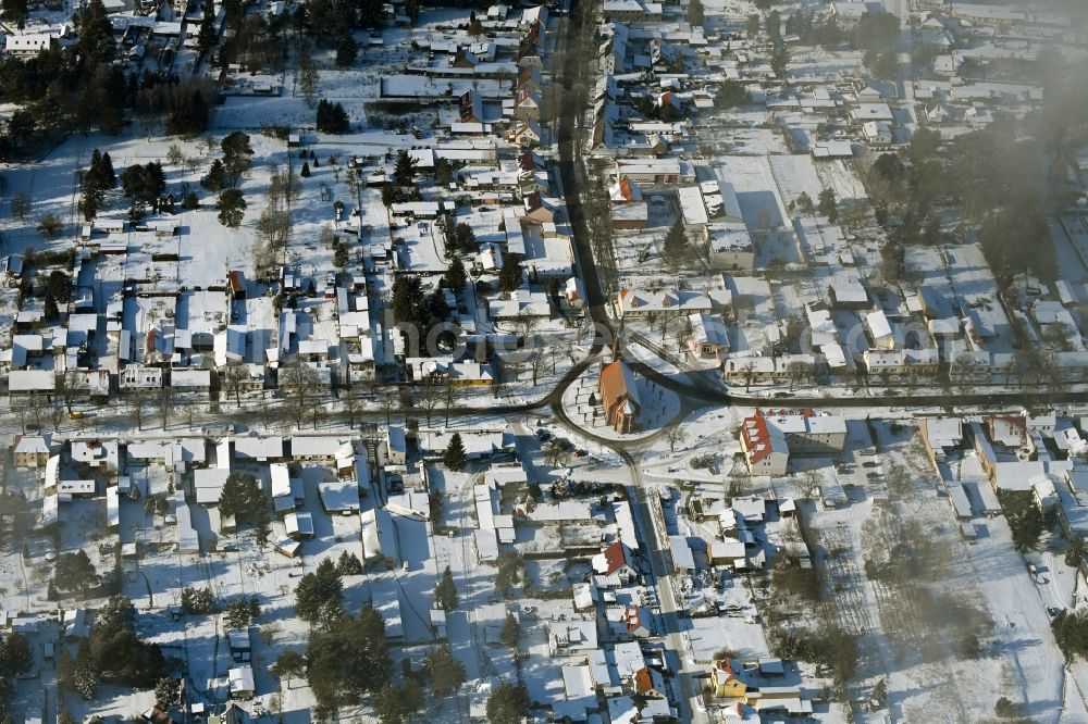 Marienwerder from the bird's eye view: Wintry snowy town View of the streets and houses of the residential areas in Marienwerder in the state Brandenburg, Germany