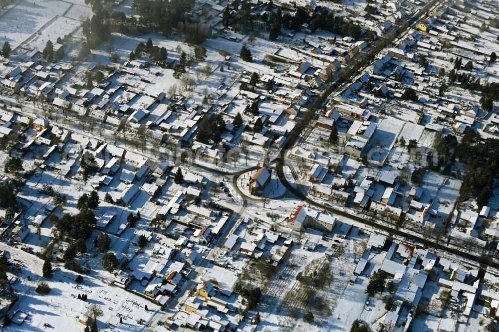 Aerial image Marienwerder - Wintry snowy town View of the streets and houses of the residential areas in Marienwerder in the state Brandenburg, Germany