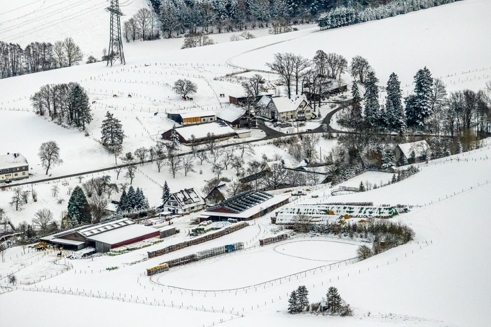 Mosebolle from the bird's eye view: Wintry snowy streets and houses and residential areas in Mosebolle at Sauerland in the state North Rhine-Westphalia, Germany