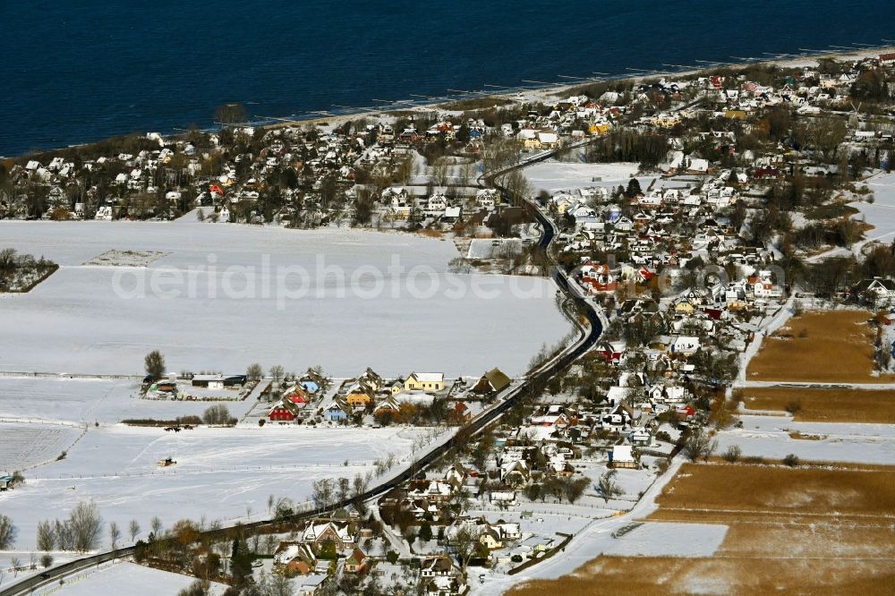 Aerial image Niehagen - Wintry snowy village view on the edge of agricultural fields and land in the district Althagen in Niehagen in the state Mecklenburg - Western Pomerania, Germany