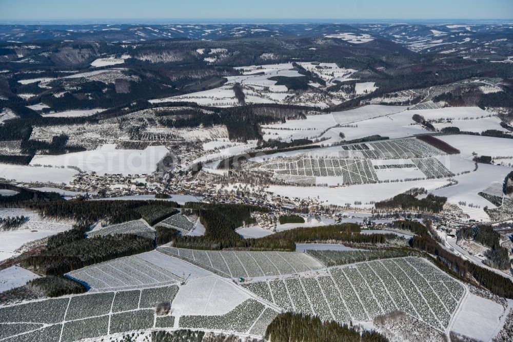 Aerial image Westfeld - Wintry snowy town View of the streets and houses of the residential areas in Westfeld at Sauerland in the state North Rhine-Westphalia, Germany