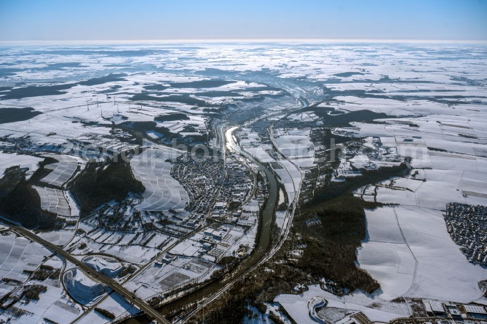 Aerial photograph Winterhausen - Wintry snowy town on the banks of the river in Winterhausen in the state Bavaria, Germany