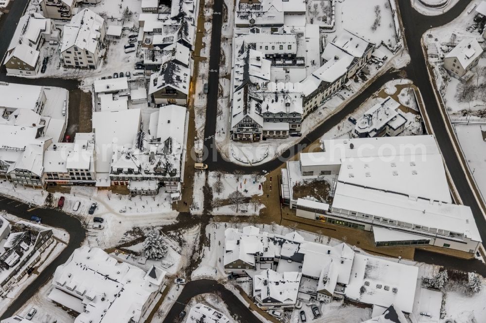 Winterberg from the bird's eye view: Wintry snowy center market in Winterberg at Sauerland in the state North Rhine-Westphalia