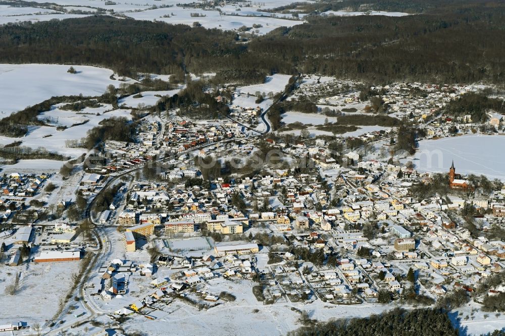 Feldberg from above - Wintry snowy village on the banks of the area lake of Feldberger Seenlandschaft in Feldberg in the state Mecklenburg - Western Pomerania, Germany