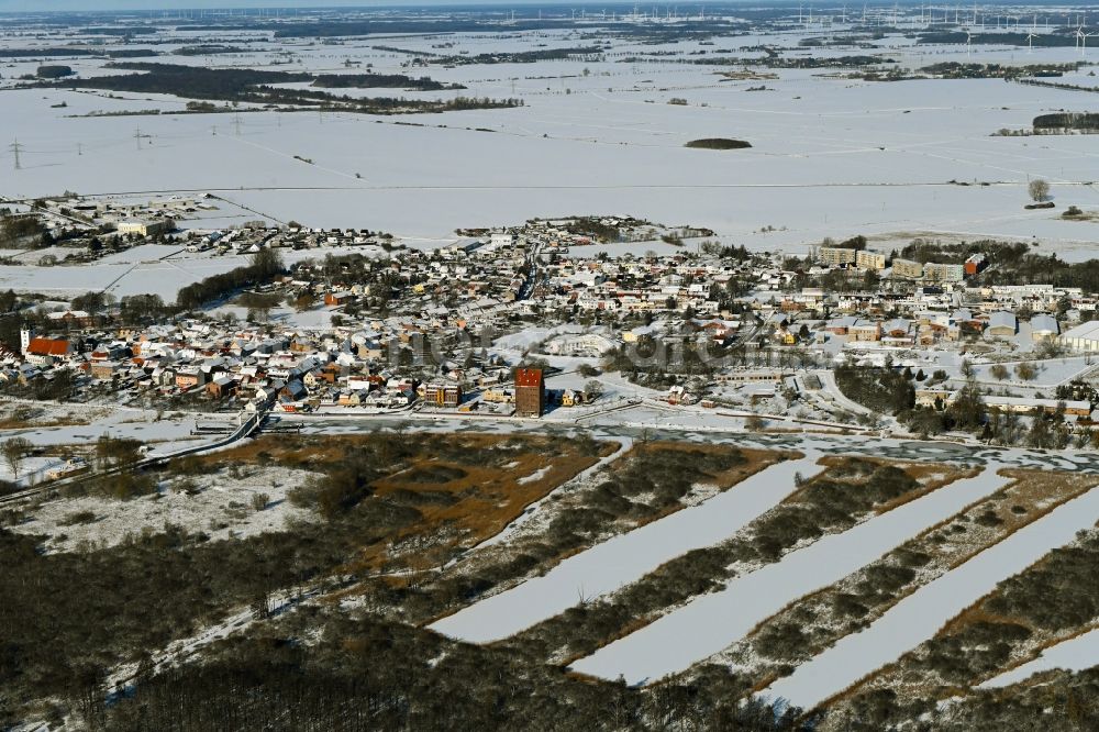 Loitz from the bird's eye view: Wintry snowy village on the banks of the area Peene - river course in Loitz in the state Mecklenburg - Western Pomerania, Germany