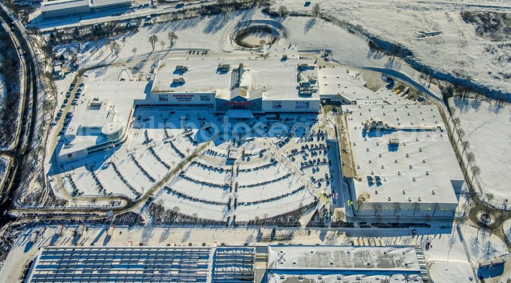 Aerial image Witten - Wintry snowy OSTERMANN Einrichtungs-Centrum Witten on Fredi-Ostermann-Strasse with parking and storage space for automobiles in Witten in the state North Rhine-Westphalia