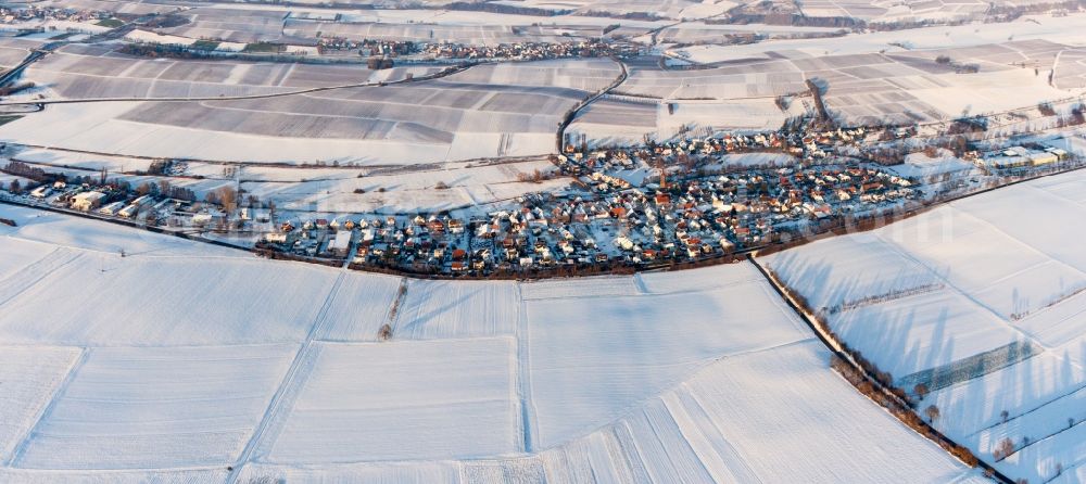 Kapellen-Drusweiler from the bird's eye view: Wintry snowy Panoramic perspective Village - view on the edge of agricultural fields and farmland in Kapellen-Drusweiler in the state Rhineland-Palatinate, Germany